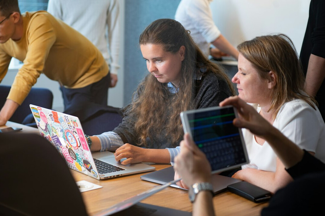 group of friends coding together